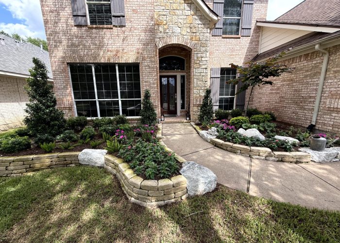 Cross Creek landscaping with Front flower beds with stone border